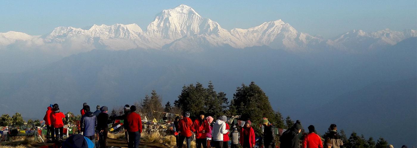 Guide showing mountains at Poon Hill